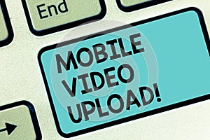 Word writing text Mobile Video Upload. Business concept for add videos on website or blog using cell phone Keyboard key