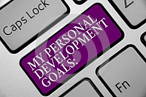 Word writing text My Personal Development Goals. Business concept for Desires Wishes Career Business planning Keyboard purple key