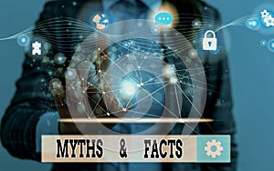 Word writing text Myths And Facts. Business concept for usually traditional story of ostensibly historical events photo