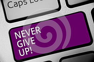 Word writing text Never Give Up. Business concept for Keep trying until you succeed follow your dreams goals Keyboard purple key I