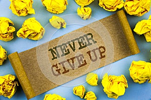 Word, writing, text Never Give Up. Business concept for Motivation Quote For Success Achievement Challenge written on tear paper