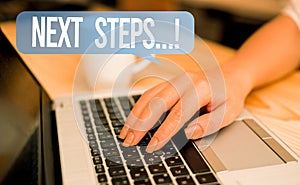 Word writing text Next Steps. Business concept for something you do after you have finished doing first one woman laptop