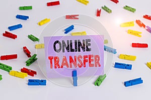 Word writing text Online Transfer. Business concept for authorizes a fund transfer over an electronic funds transfer Colored photo