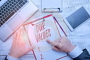 Word writing text Our Values. Business concept for list of morals companies or individuals commit to do them.
