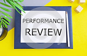 Word writing text Performance Review. Business Concept to identifies strengths and weaknesses, offers feedback, and sets goals for