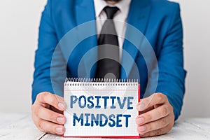 Word writing text Positive Mindset. Business concept for mental attitude in wich you expect favorable results Man holds