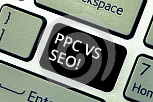 Word writing text Ppc Vs Seo. Business concept for Pay per click against Search Engine Optimization strategies Keyboard