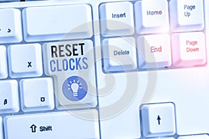 Word writing text Reset Clocks. Business concept for To revisit return to or recreate a time or era from the past White