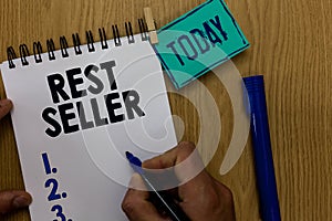 Word writing text Rest Seller. Business concept for one feature or the perceived benefit good which makes it unique Man holding ma