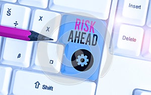 Word writing text Risk Ahead. Business concept for A probability or threat of damage, injury, liability, loss White pc