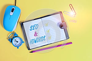 Word writing text Seo And Adwords. Business concept for Pay per click Digital marketing Google Adsense Locked diary