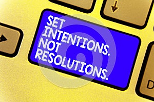 Word writing text Set Intentions. Not Resolutions.. Business concept for Positive choices for new start achieve goals Keyboard blu