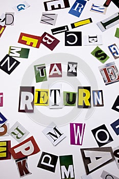 A word writing text showing concept of TAX RETURN made of different magazine newspaper letter for Business case on the white backg