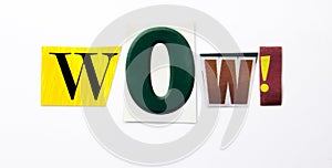 A word writing text showing concept of Wow made of different magazine newspaper letter for Business case on the white background w