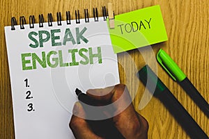 Word writing text Speak English. Business concept for Study another Foreign Language Online Verbal Courses Man holding marker note