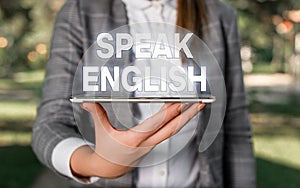 Word writing text Speak English. Business concept for Study another Foreign Language Online Verbal Courses Outdoor scene