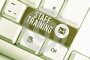 Word writing text Staff Training. Business concept for program that helps employees learn specific knowledge White pc keyboard