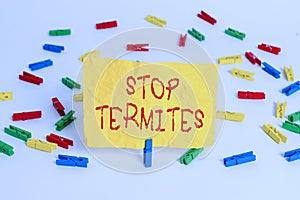 Word writing text Stop Termites. Business concept for prevent a small tropical insect from damaging the woods Colored clothespin