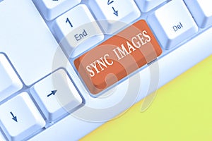Word writing text Sync Images. Business concept for Making photos identical in all devices Accessible anywhere White pc