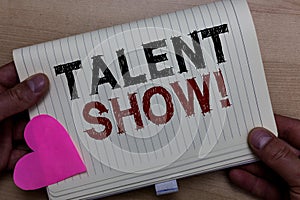 Word writing text Talent Show. Business concept for Competition of entertainers show casting their performances Man holding notebo