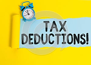 Word writing text Tax Deductions. Business concept for reduction income that is able to be taxed of expenses.