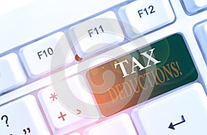 Word writing text Tax Deductions. Business concept for reduction income that is able to be taxed of expenses White pc