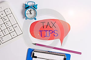 Word writing text Tax Tips. Business concept for compulsory contribution to state revenue levied by government Flat lay