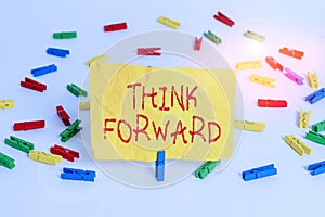 Word writing text Think Forward. Business concept for The act of thinking about and planning for the future Colored clothespin