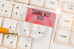 Word writing text Think Win Win. Business concept for Business Strategy Competition Challenge Way to be success White pc