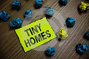 Word writing text Tiny Homes. Business concept for houses contain one room only or two and small entrance Cheap Yellow piece paper