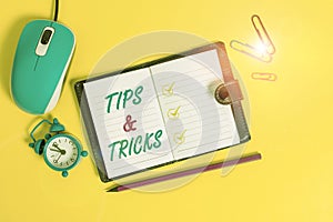 Word writing text Tips And Tricks. Business concept for Steps Lifehacks Handy advice Recommendations Skills Locked diary photo