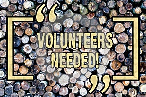 Word writing text Volunteers Needed. Business concept for Social Community Charity Volunteerism Wooden background photo