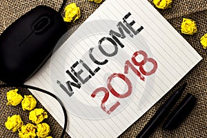 Word writing text Welcome 2018. Business concept for Celebration New Celebrate Future Wishes Gratifying Wish written on Notebook P