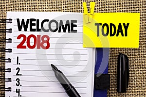 Word writing text Welcome 2018. Business concept for Celebration New Celebrate Future Wishes Gratifying Wish written on Notebook b photo
