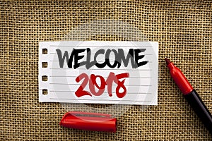 Word writing text Welcome 2018. Business concept for Celebration New Celebrate Future Wishes Gratifying Wish written on Notebook P
