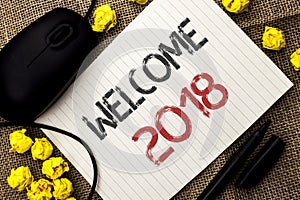 Word writing text Welcome 2018. Business concept for Celebration New Celebrate Future Wishes Gratifying Wish written on Notebook P photo