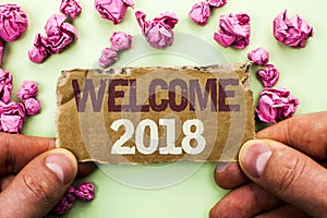 Word writing text Welcome 2018. Business concept for Celebration New Celebrate Future Wishes Gratifying Wish written on Tear Cardb