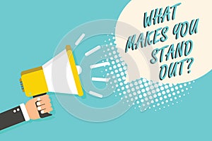 Word writing text What Makes You Stand Out question. Business concept for asking someone about his qualities Man holding megaphone