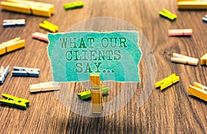 Word writing text What Our Clients Say.... Business concept for your customer feedback using poll or written paper Clothespin hold