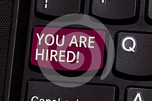 Word writing text You Are Hired. Business concept for Recruitment being selected for a job the right candidate Keyboard