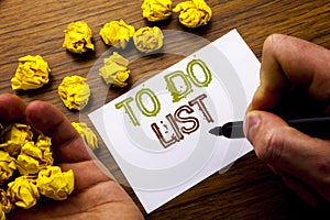 Word, writing To Do List. Concept for Plan Lists Remider written on notebook note paper on the wooden background with folded paper photo