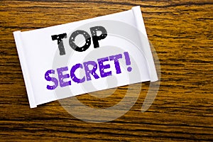 Word, writing Top Secret. Business concept for Military Top Secret written on sticky note paper on the wooden wood structure visib