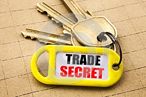 Word, writing Trade Secret. Business concept for Data Protection Written on key holder, textured background close up.