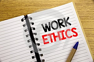 Word, writing Work Ethics. Business concept for Moral Benefit Principles written on notepad with copy space on old wood wooden bac