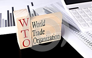 Word WTO - World Trade Organization made with wood building blocks, business concept