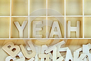 Word yeah made with block wooden letters