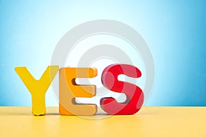 Word YES over beautiful reverberation gradient background