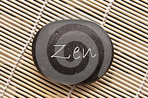 Word zen written on a black stone