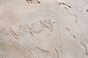 Wording Vacay on Beach Sand Background