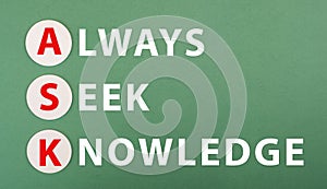 The words ask always seek knowledge are standing on a green colored paper, education concept